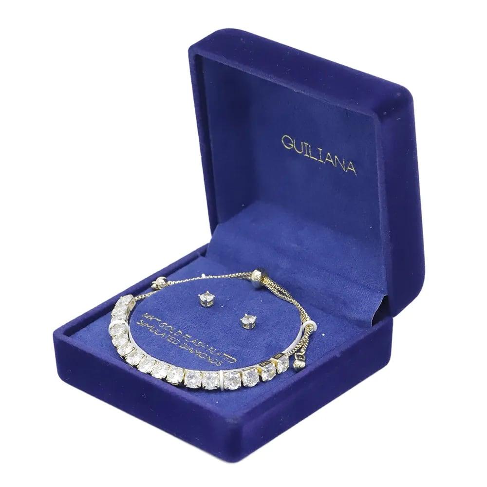 Set de aretes y pulsera ajustable con zirconias de brass en baño de oro